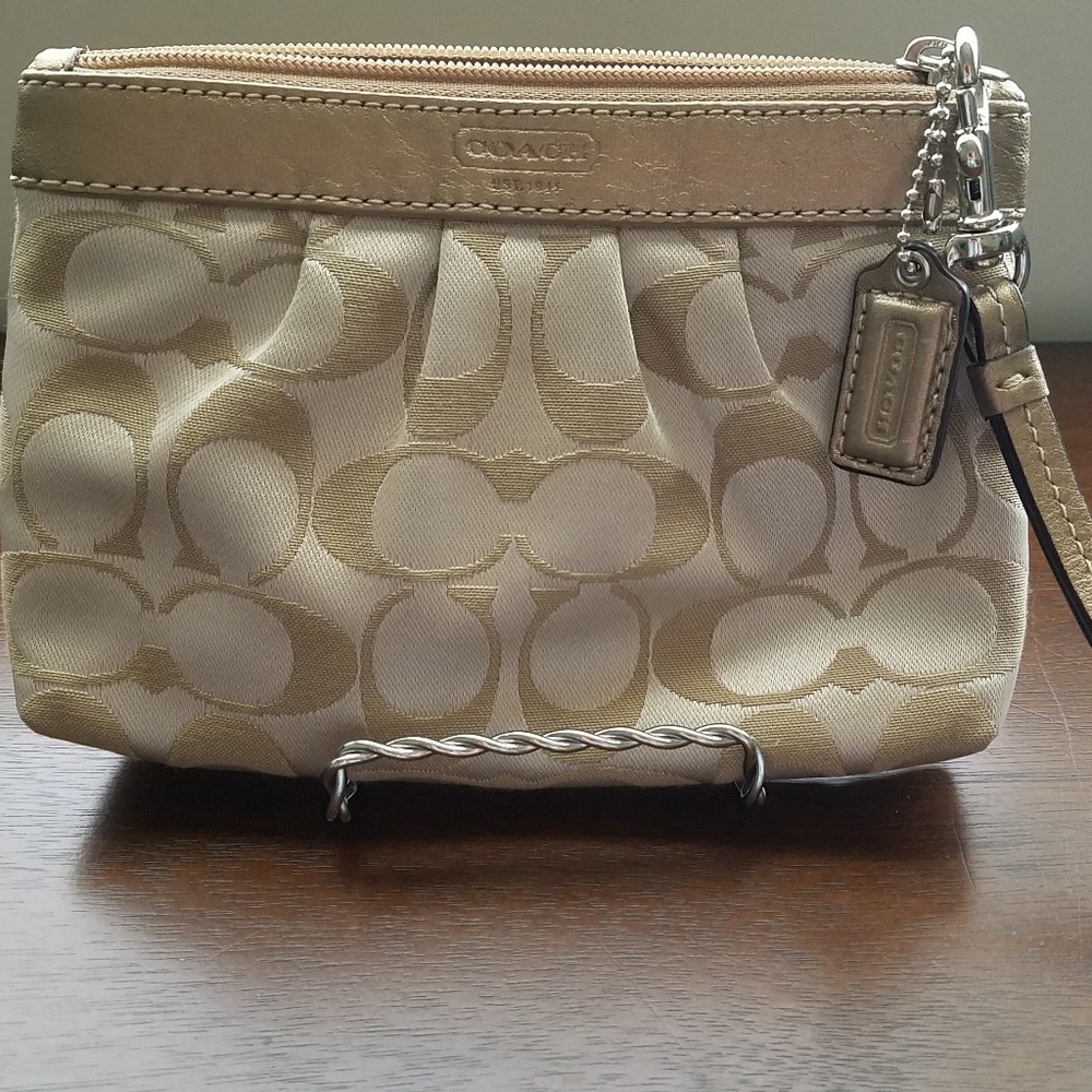 Gold COACH wristlet